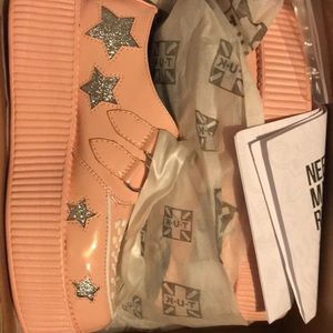 Dolls Kill Star pink platforms.